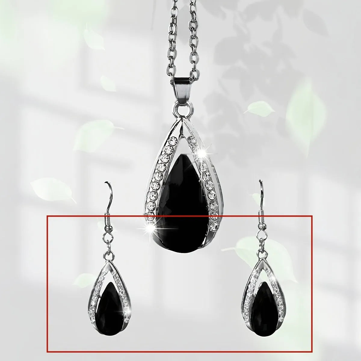 Black and red alloy teardrop pendant necklace with matching earrings set.