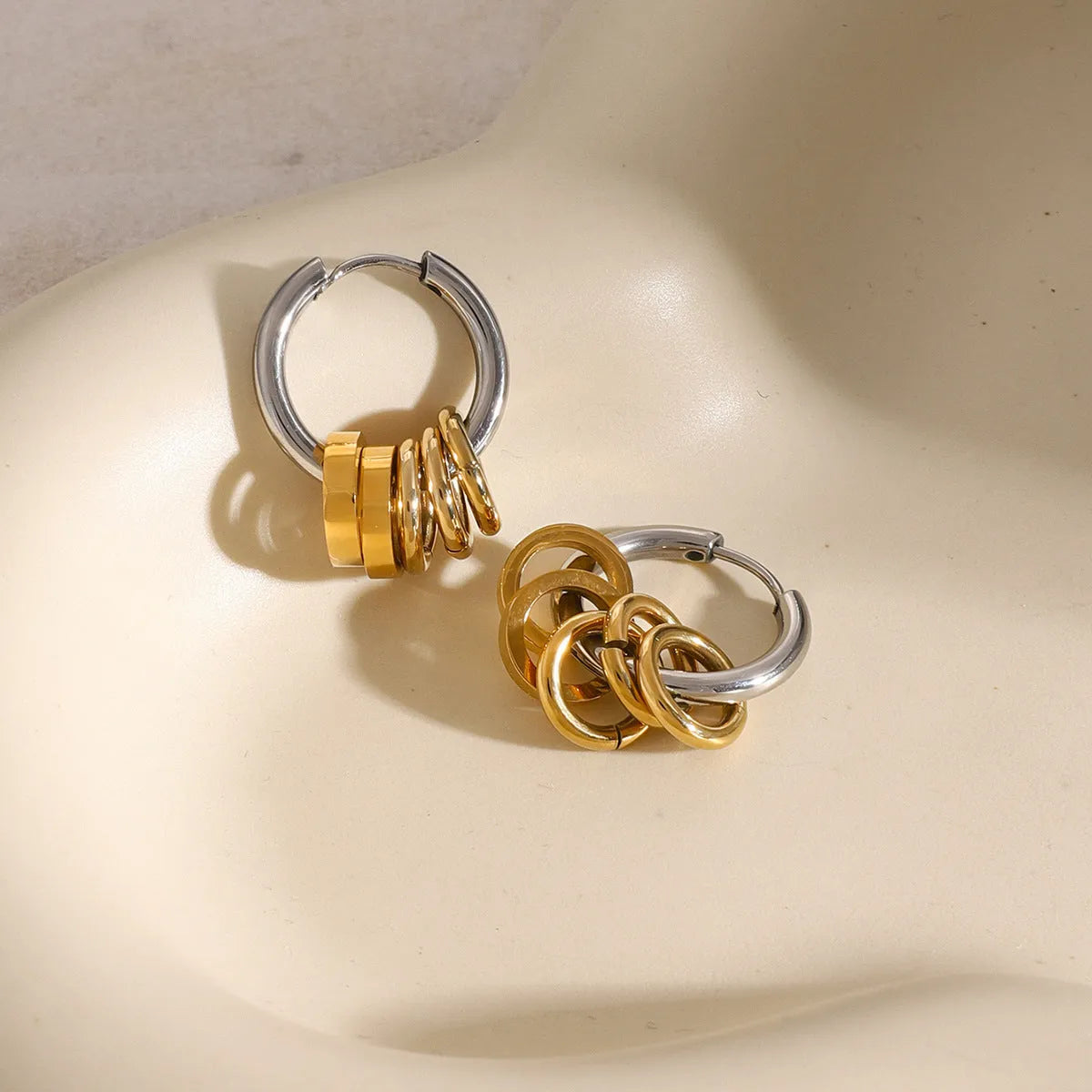 Ins style stainless steel colour matching earrings with electroplated finish showing unisex design