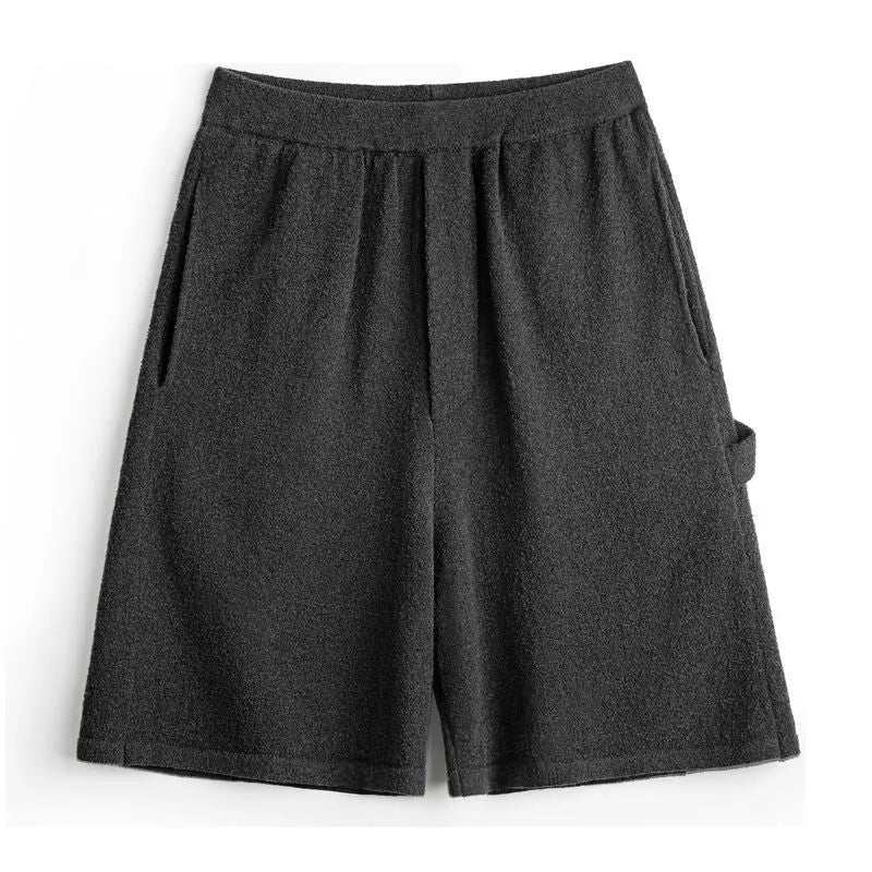 Cement grey polyester sports shorts with straight leg loose fit and elastic waistband
