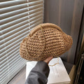 Women's shell-shaped straw shoulder bag with paper construction and zippered interior compartment