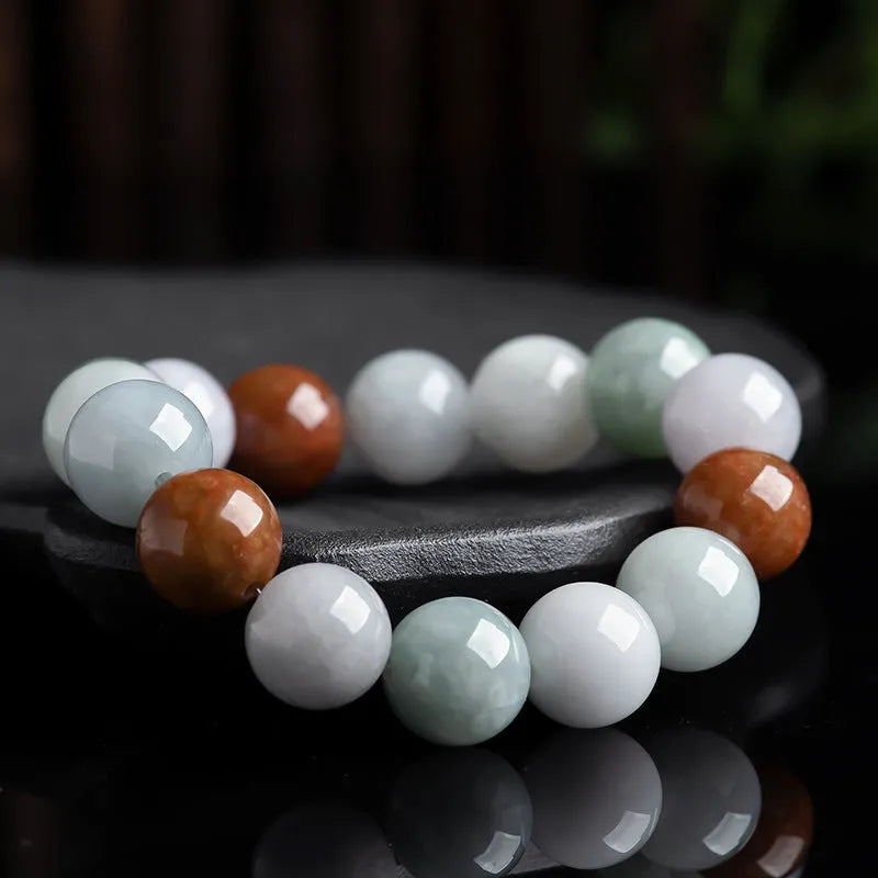 Women's natural Myanmar jade bracelet showing three colours in 13mm round bead design