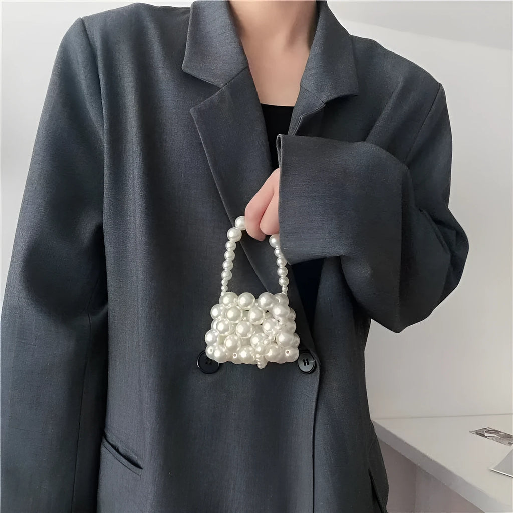 Women's imitation pearl mini crossbody handbag with geometric pattern in a pearl tote colour.