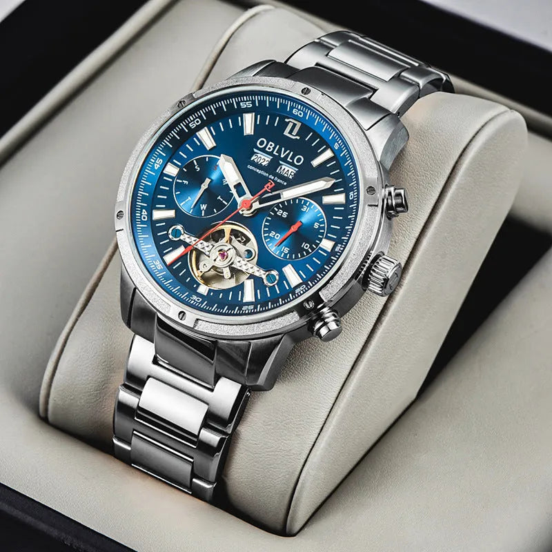 Men's multi-functional hollowed fashion watch with date display, steel strap, silver blue colour
