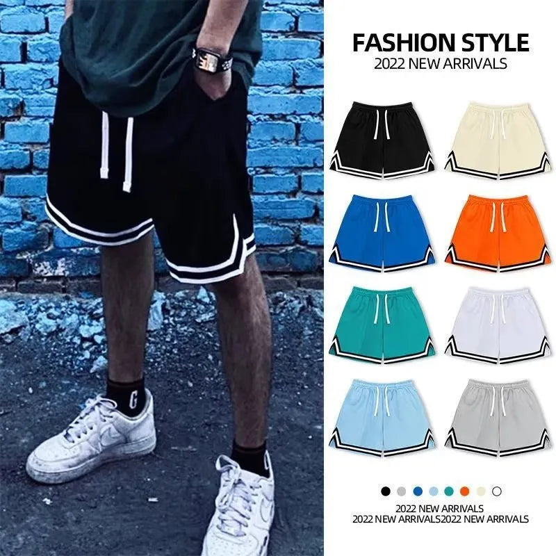 Men's loose fit polyester sports shorts in various colours on a size chart background.