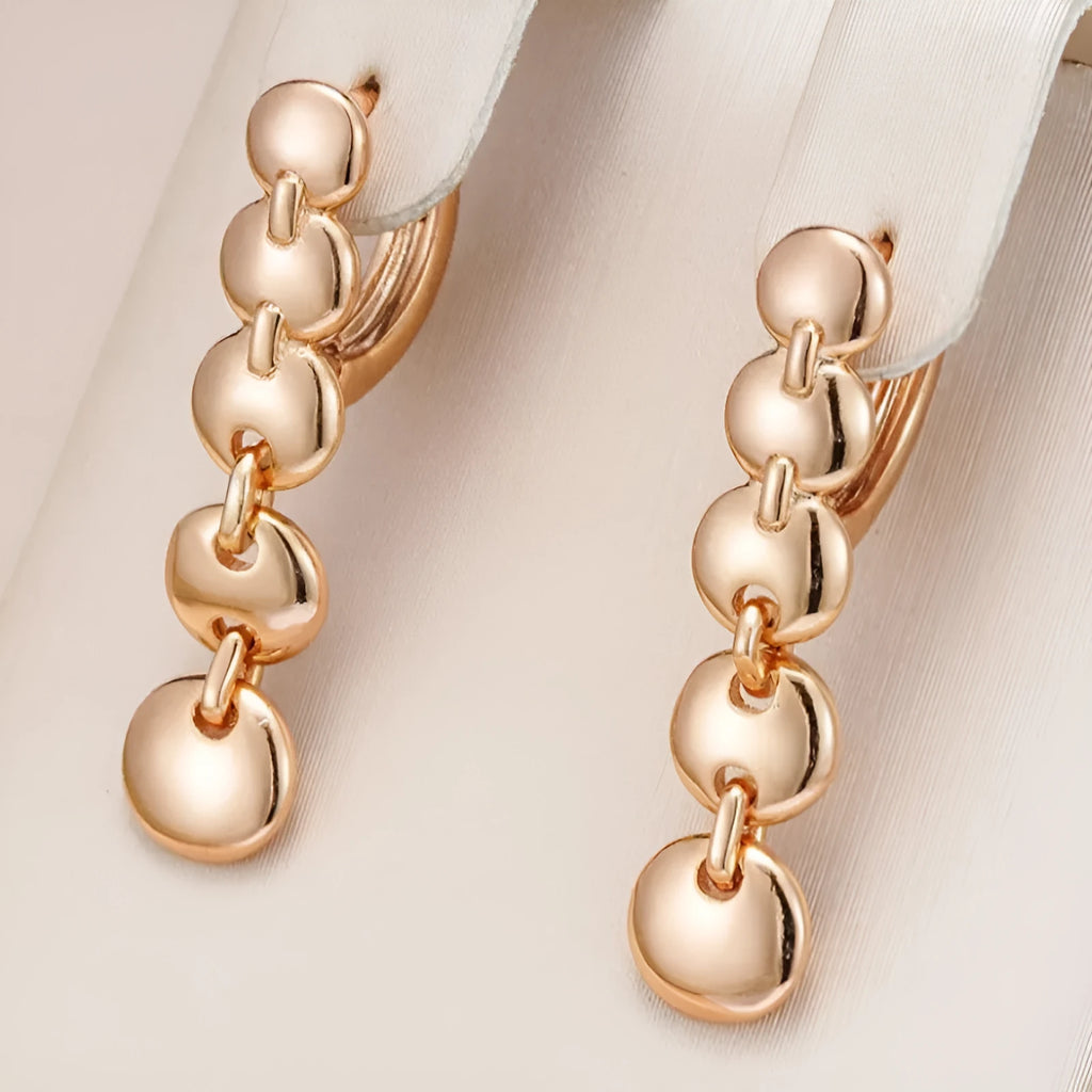 Retro gold tone woven copper circle drop earrings with vintage styling
