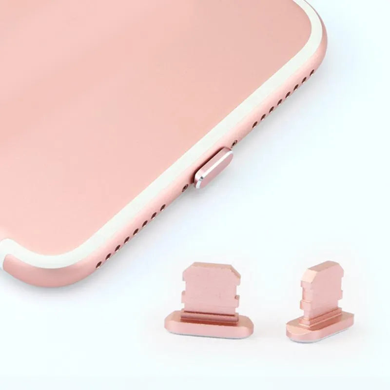 Aluminium alloy iPhone charging port dust plug in metallic colours on a dark background.