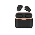 Black wireless Bluetooth headphones with charging stand on a table