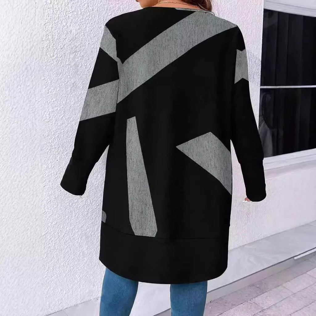 Black loose fit knit cardigan coat with button front on a hanger.