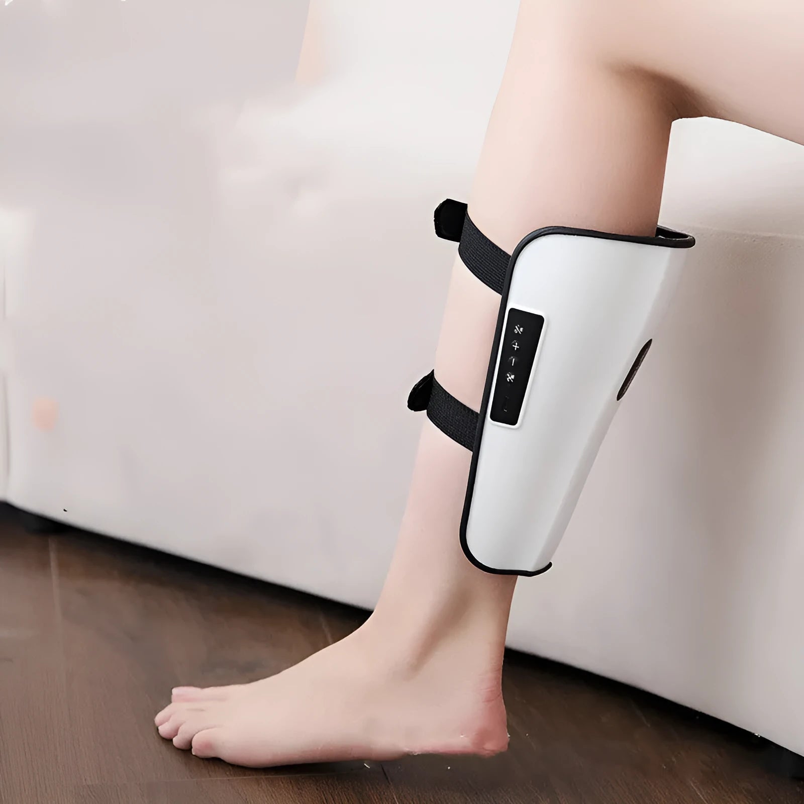 White plastic leg and calf massager device with a mechanical control panel and a USB Type-C charging port.