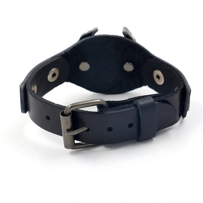 Black leather geometric bracelet with an alloy eagle clasp on a wrist.