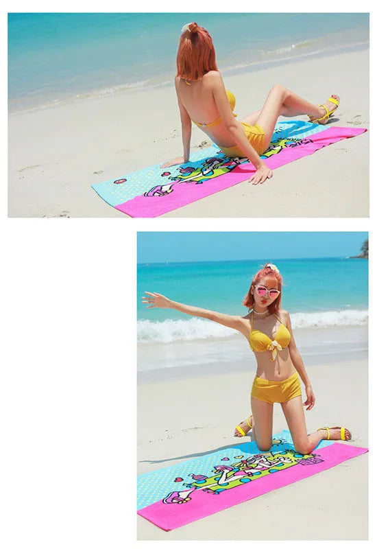Flower-coloured swimming absorbent microfiber towel 150x70cm on a beach background