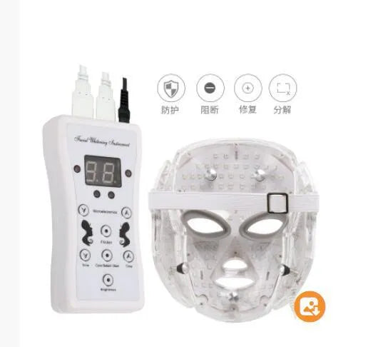 White LED light therapy face mask with opaque eye protection, remote control, and neck care section on a flat surface