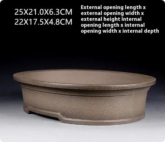 Handmade antique oval purple sand ceramic bonsai pot measuring 25cm by 21cm by 6.3cm