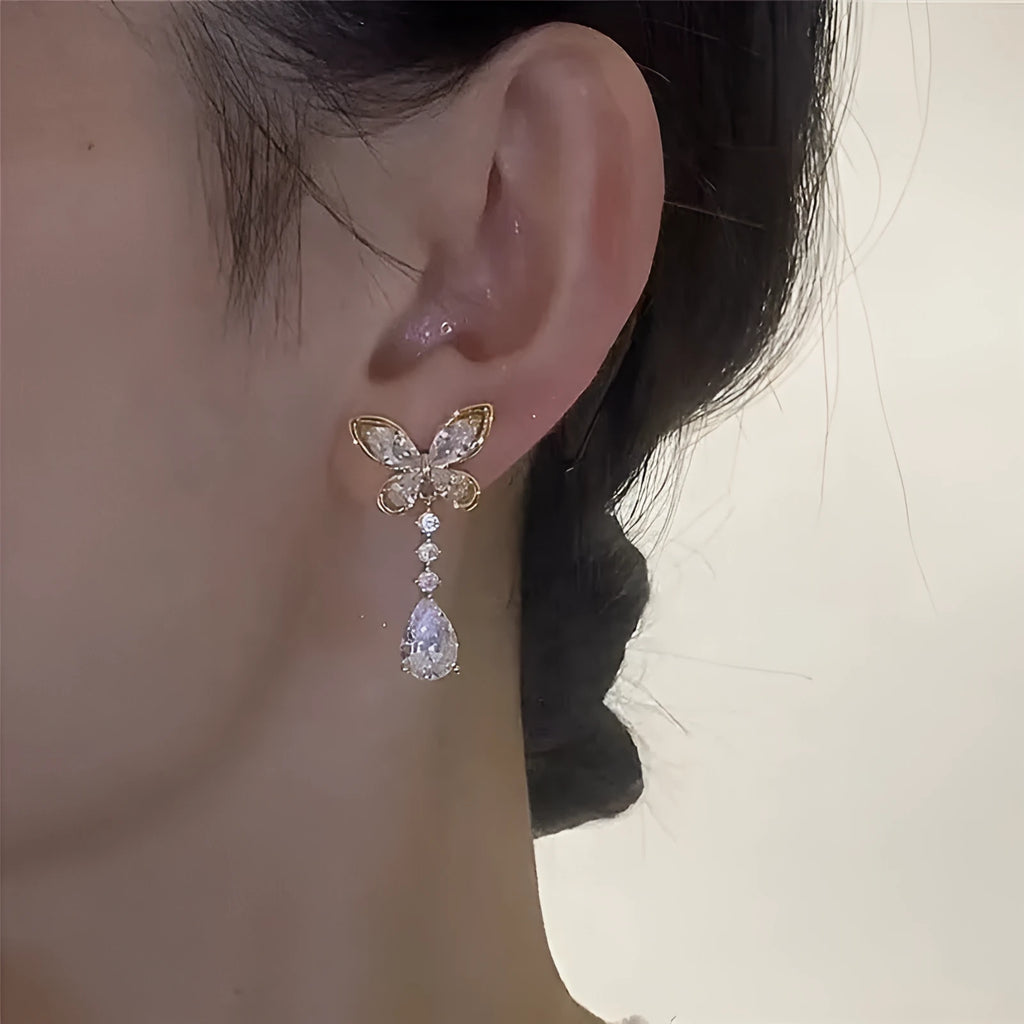 Platinum colour bow-shaped stud earrings with zinc alloy electroplated construction