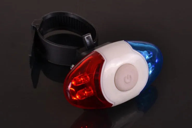 Red and blue LED bicycle tail light with adjustable mounting base.