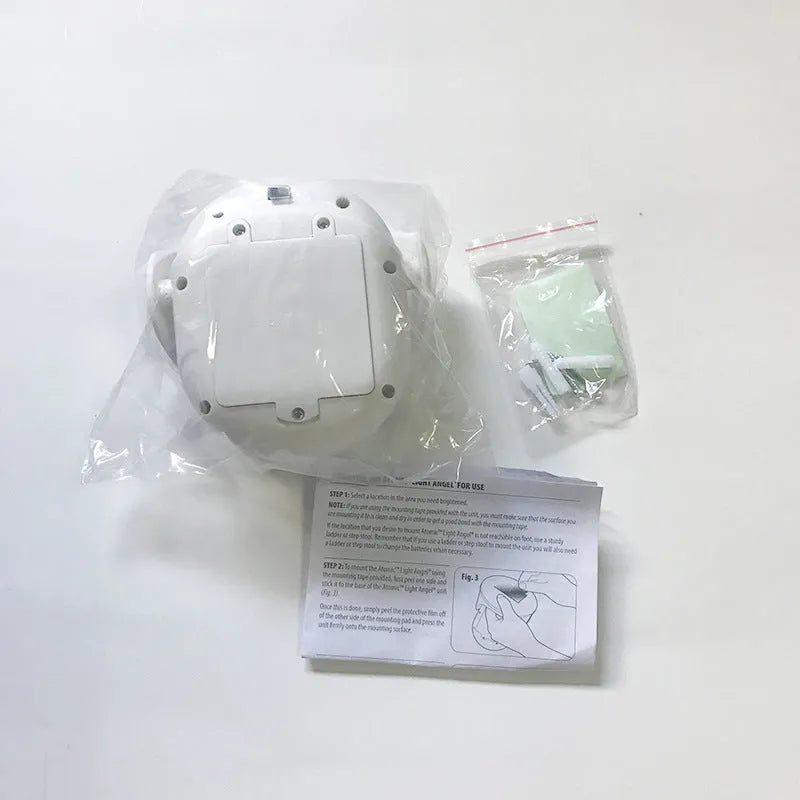 Atomic Angel white induction light with ABS plastic housing measuring 13.3 by 9.8 by 15.8 centimetres