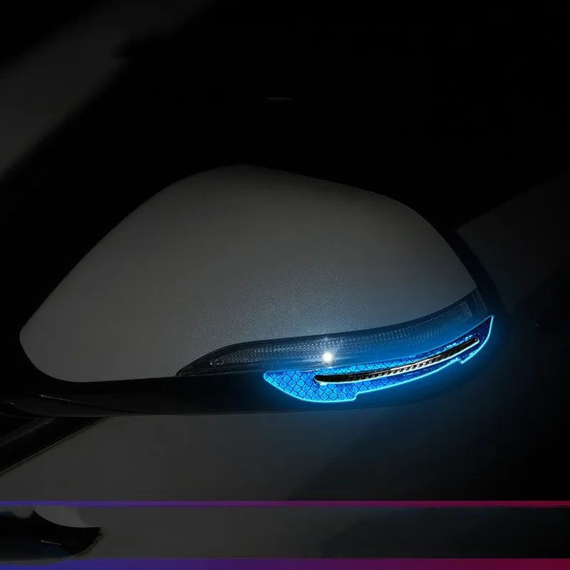 Blue and yellow reflective resin strips for car bumper and wheel arch protection.