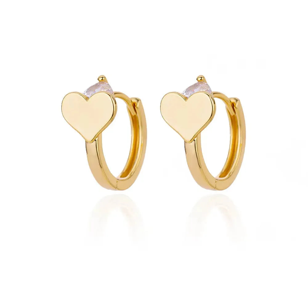 A pair of gold-coloured heart-shaped stud earrings for women on a white background.