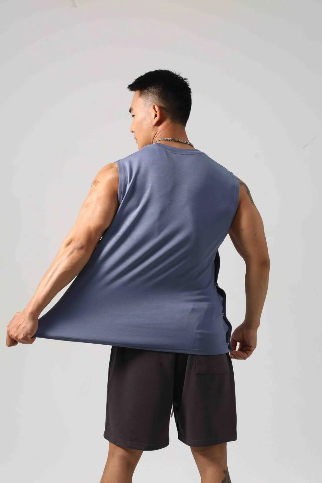 Men's loose grey cotton fitness vest with a hidden hook opening at the front.