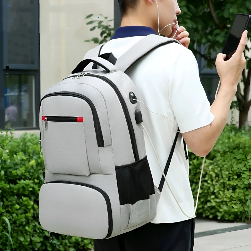 Light grey insulated Oxford cloth backpack with curved shoulder straps, shown with dry-wet separation compartment open.