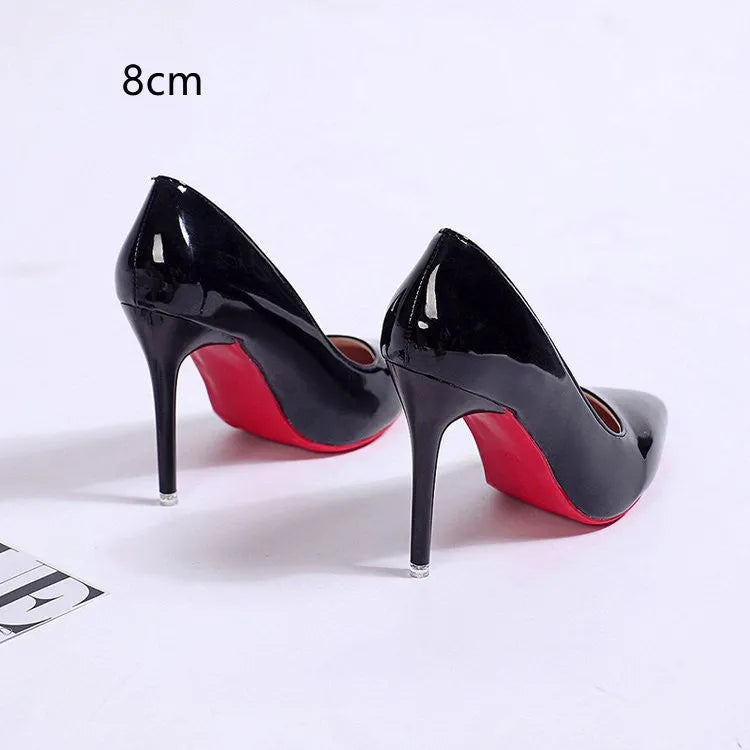 Women's pointed toe stiletto heel pumps in black with shallow mouth opening