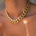 Women's thick gold chain necklace showing 32cm length with electroplated finish and simple solid colour design