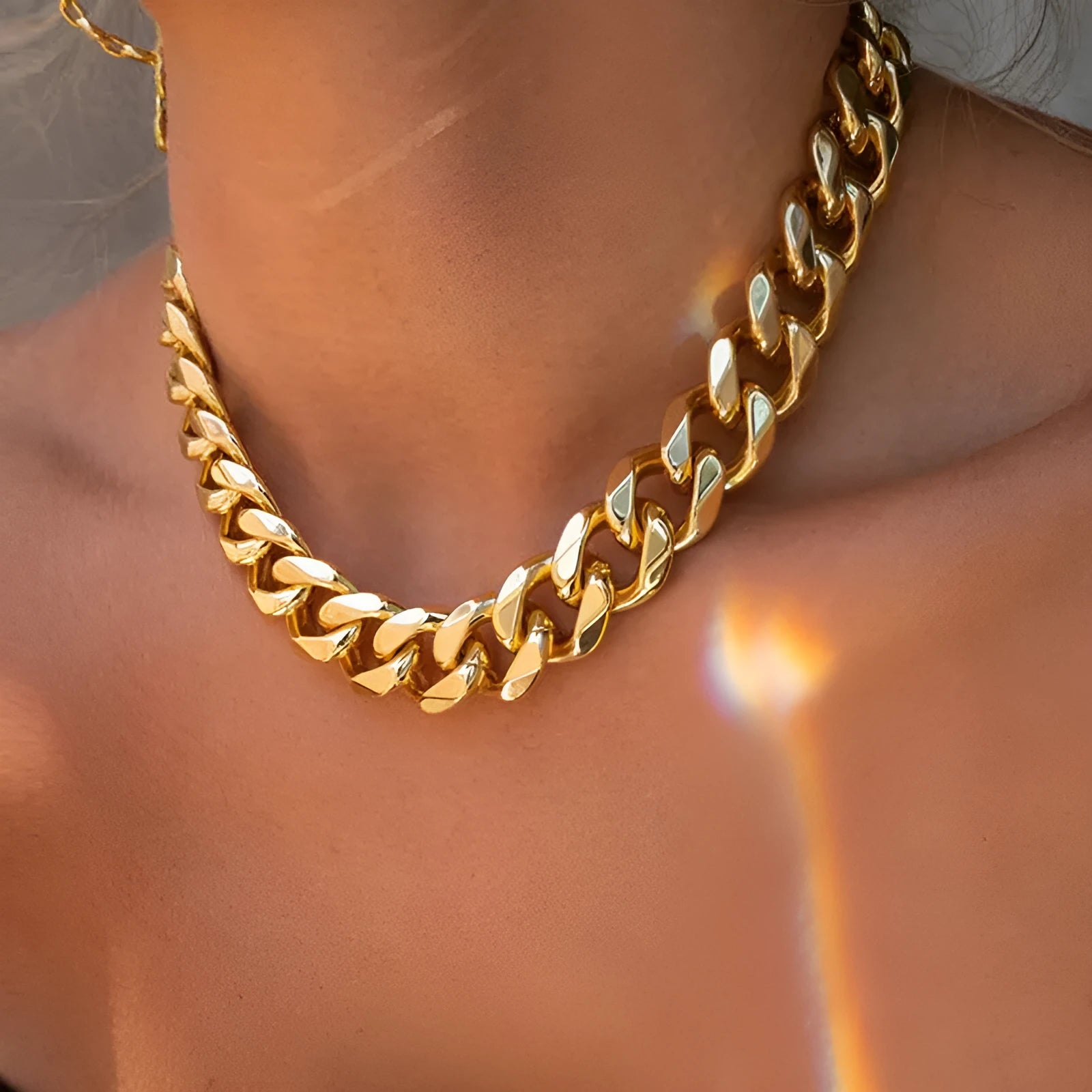 Women's thick gold chain necklace showing 32cm length with electroplated finish and simple solid colour design