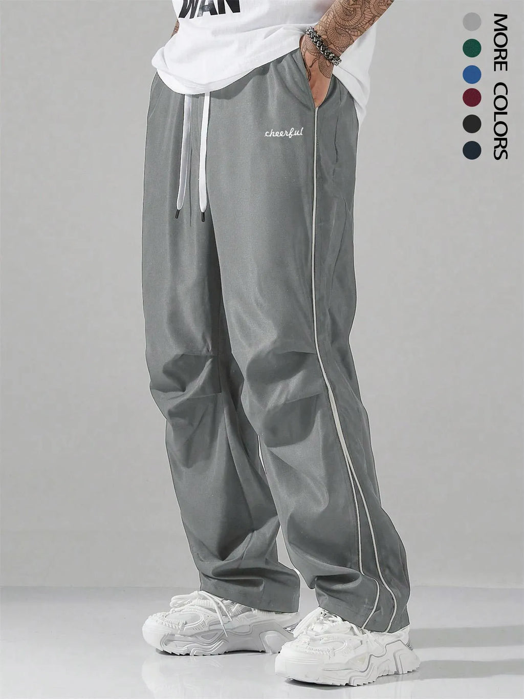 High street charging paratrooper pants for teenagers in straight leg style, available in multiple colours like black and dark green
