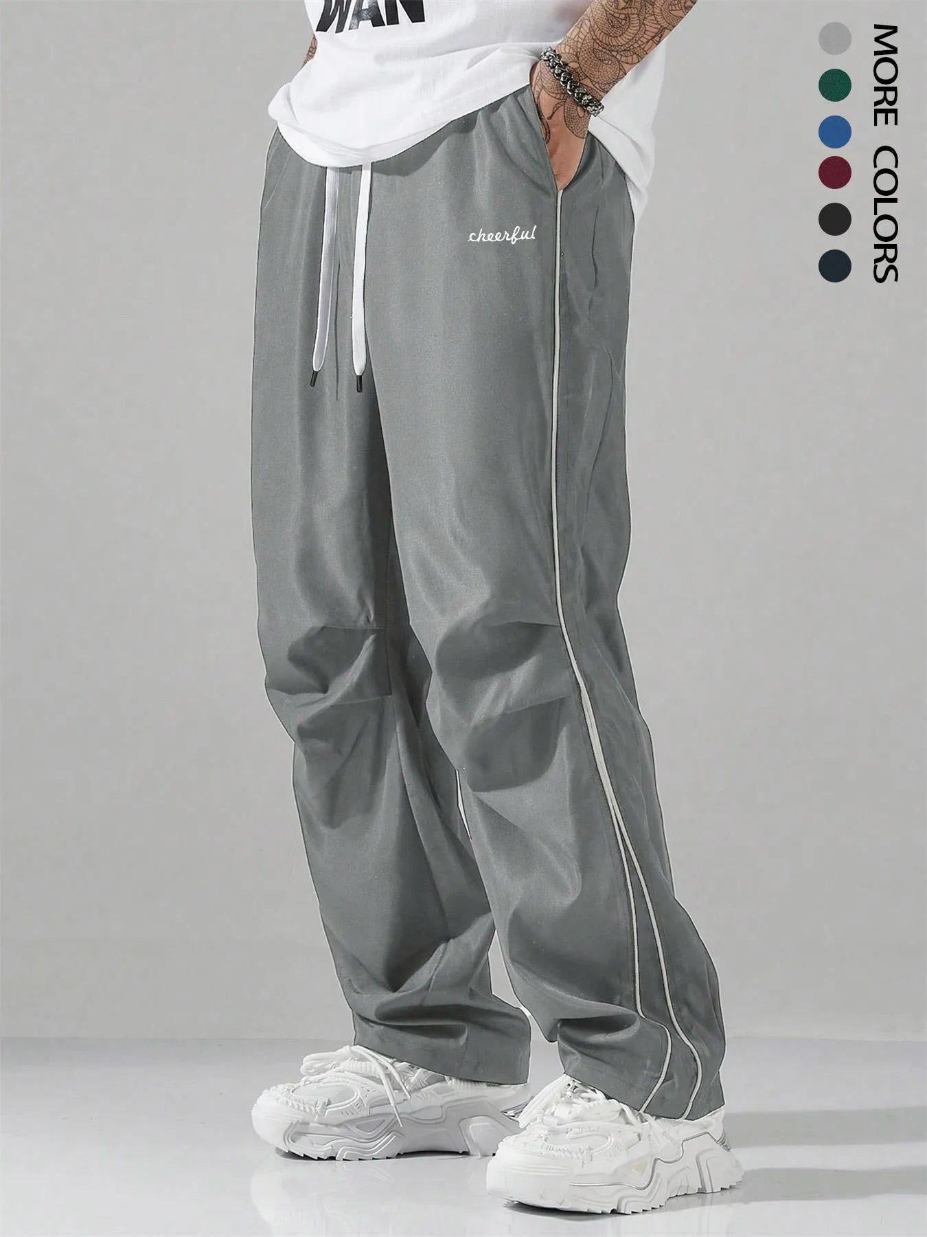 High street charging paratrooper pants for teenagers in straight leg style, available in multiple colours like black and dark green