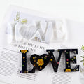 Six silicone epoxy moulds with English letter designs including love, home, family, Live, hello, and Blessed