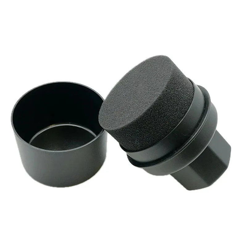 Black tyre polishing sponge brush with lid on a car tyre, showing high-density sponge applicator head.