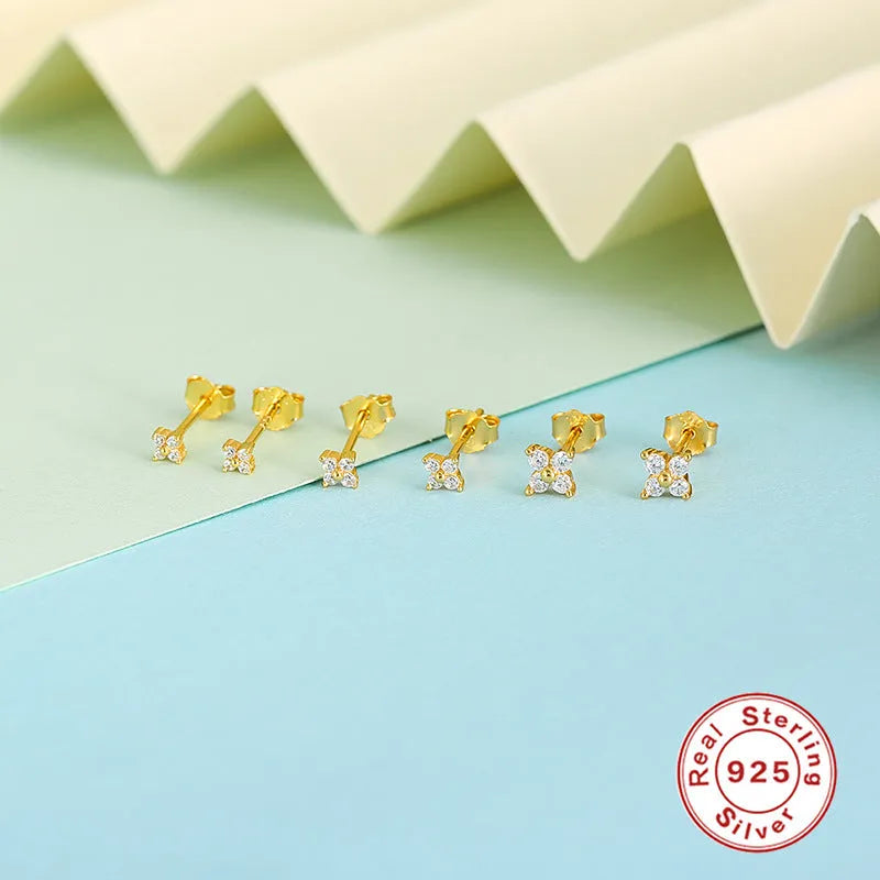S925 sterling silver stud earrings with a geometric petal crystal flower in gold or platinum finish.