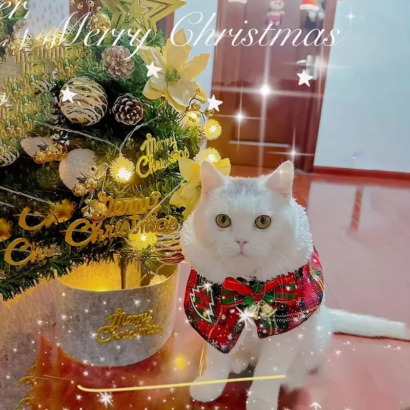 Red polyester pet scarf with snowflake bell design tied around a dog's neck for Christmas