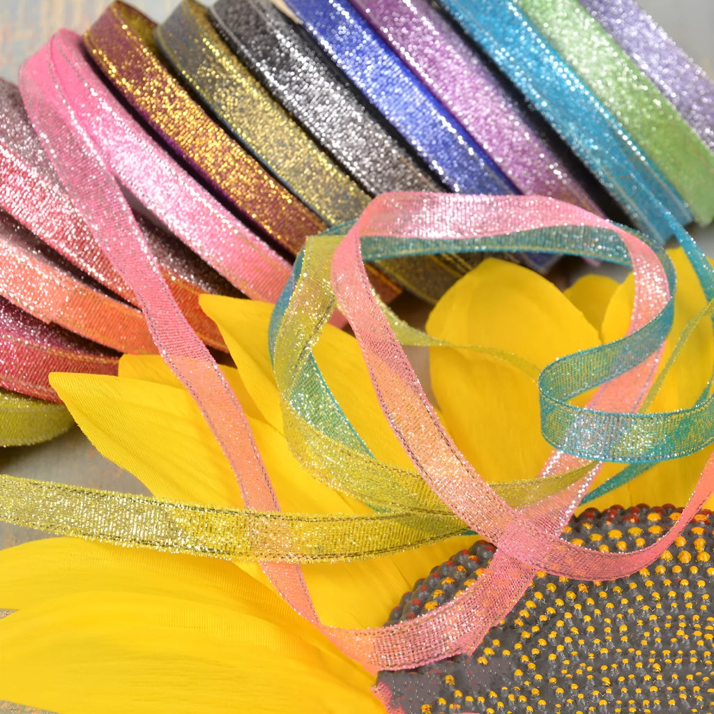 Polyester ribbon roll in green onion colour with gold wire trim showing 3-point width