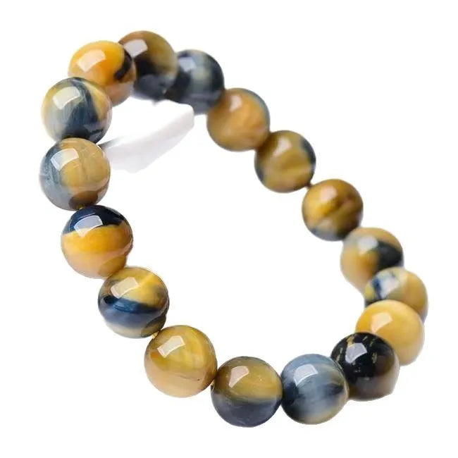 Fantasy Tiger Eye agate bracelet with round beads on a wrist, showing 10mm bead size.