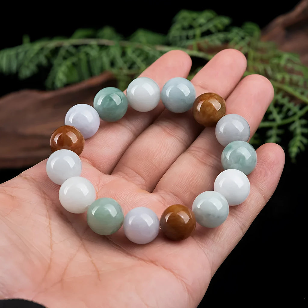 Women's natural Myanmar jade bracelet showing three colours in 13mm round bead design