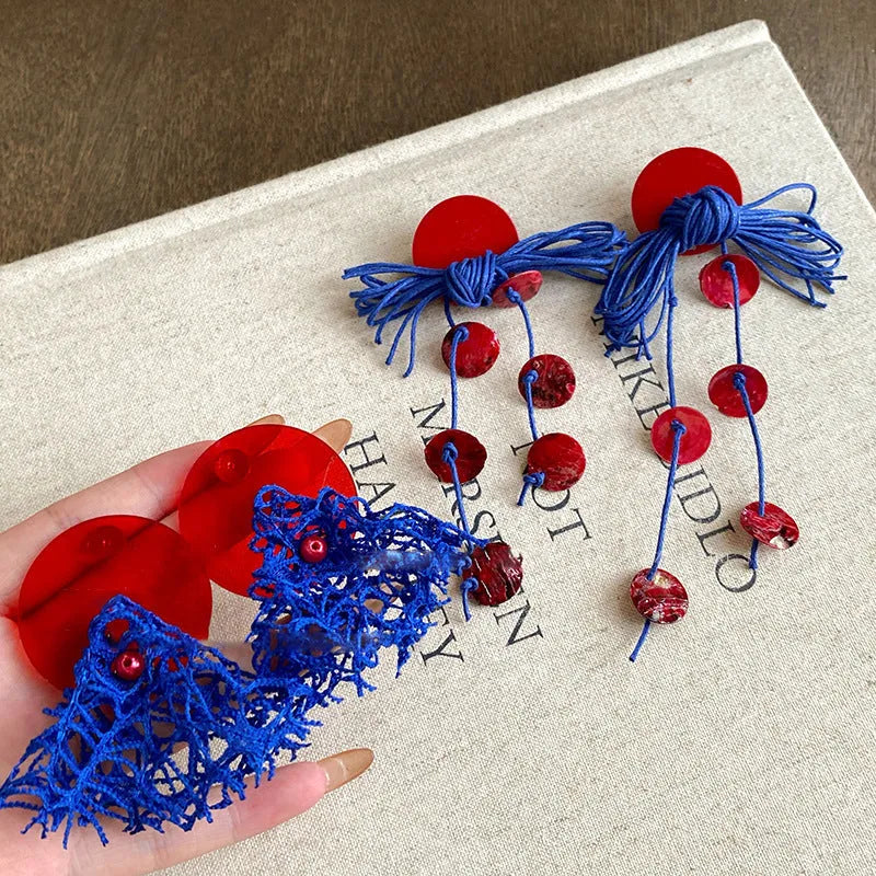 Women's handmade geometric cloth earrings with blue resin flower colour detail