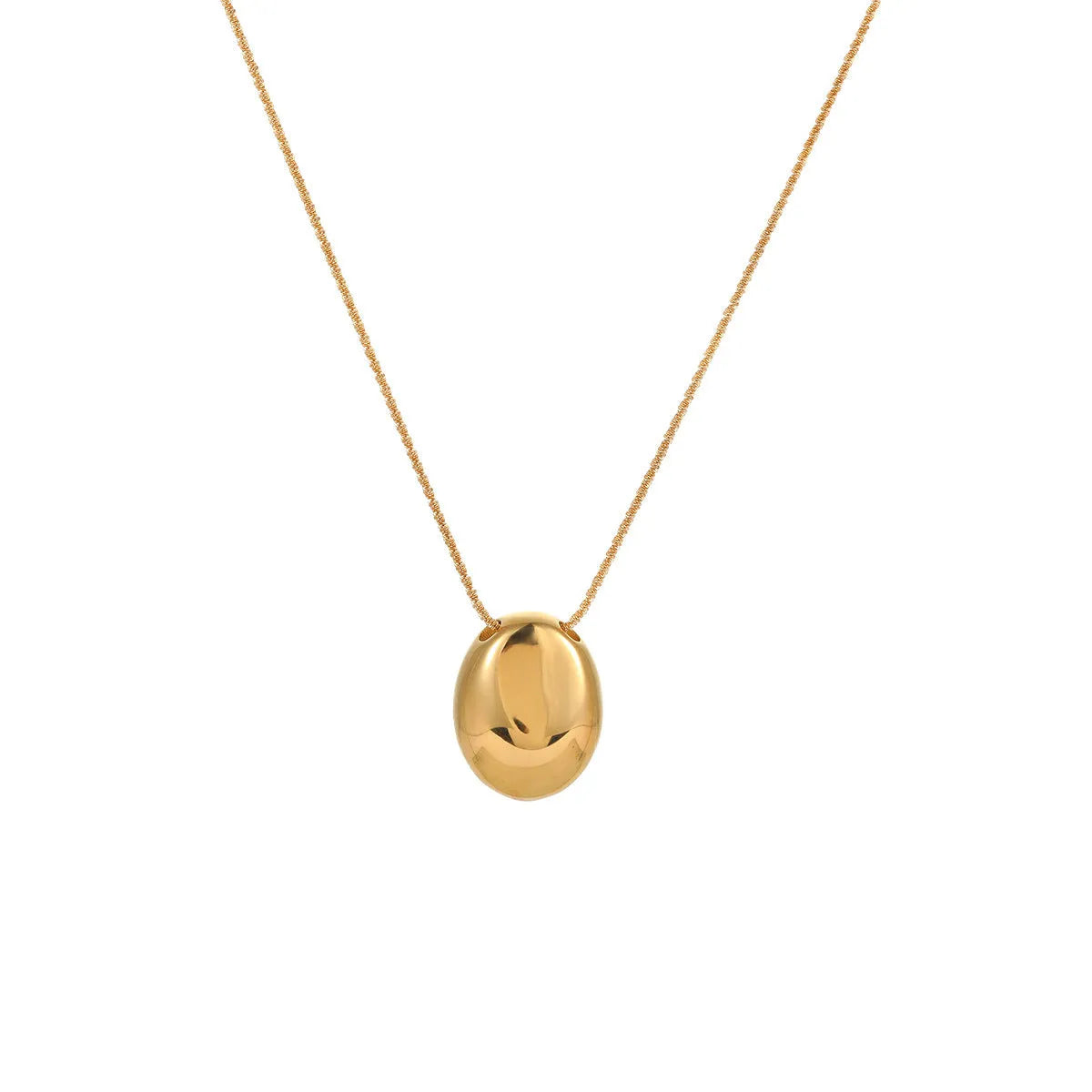 Gold geometric pendant necklace on adjustable chain against white background