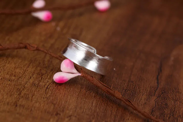Geometric open ring with frosted sterling silver finish and adjustable opening