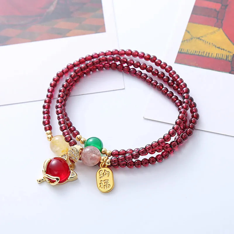Natural garnet fox bracelet with adjustable rope closure in purplish red colour