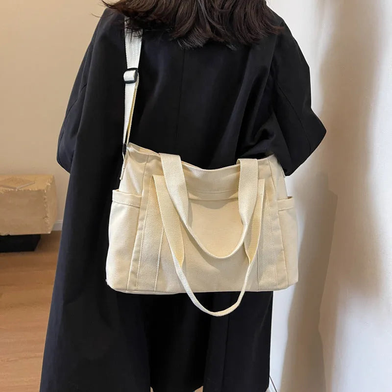 Women's solid colour shoulder bag with large capacity and mobile phone compartment in four colour options