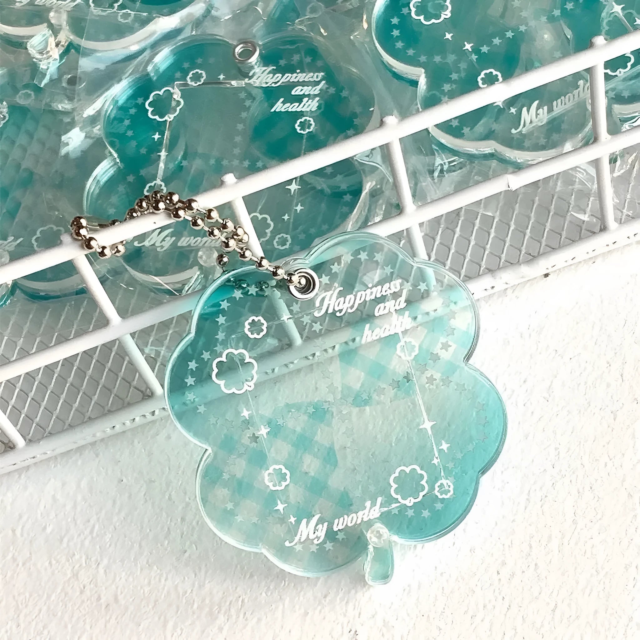 Acrylic four-leaf clover phone pendant keychain in blue, green, or mint