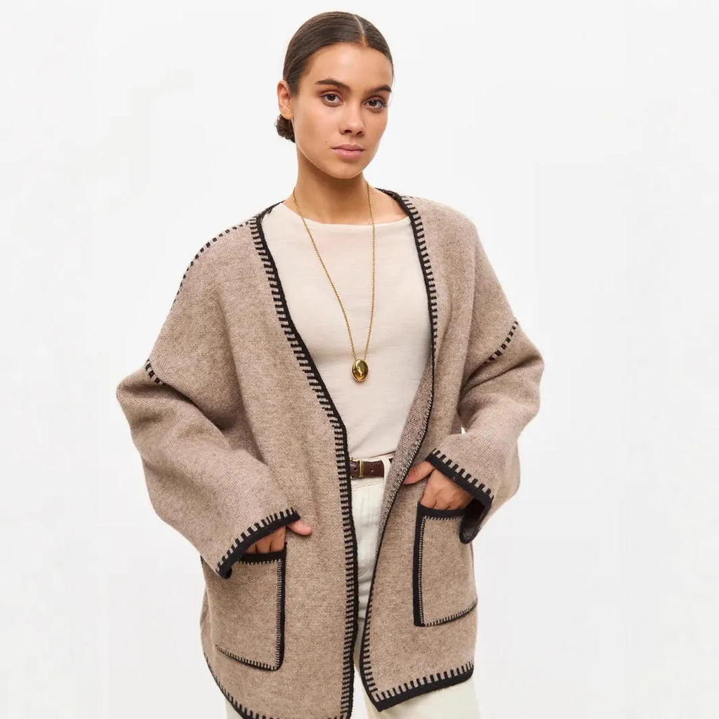 Loose fit knitted cardigan with lace-up sleeves in camel colour showing mid-length design