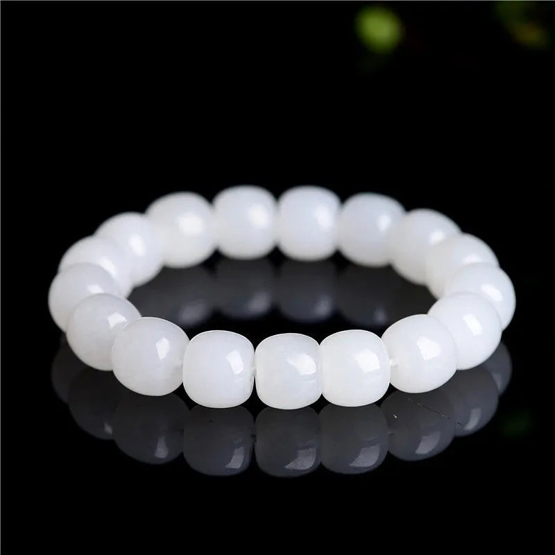 White Hetian jade barrel bead bracelet showing smooth pale stone beads in uniform barrel shape