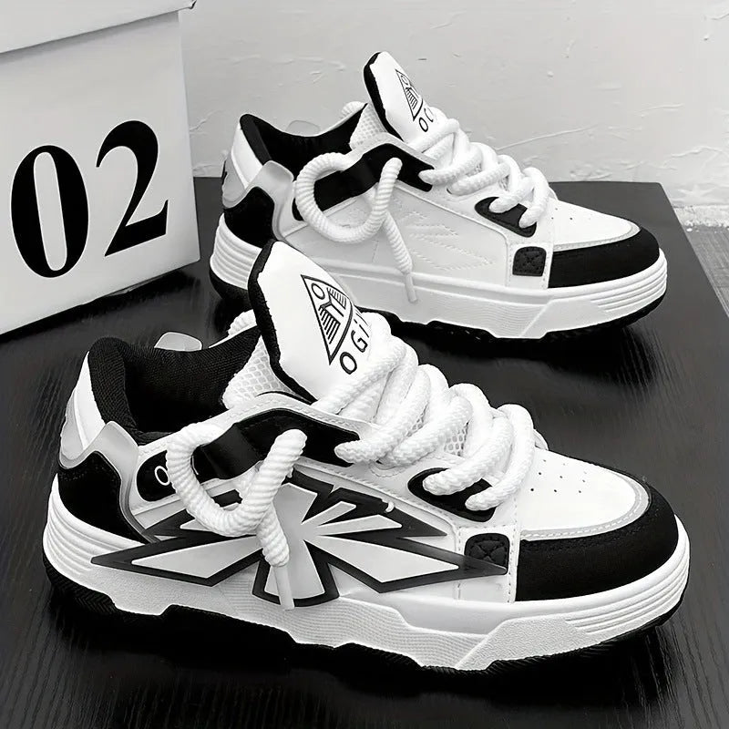 Men's white chunky sneakers with thick rubber sole, cartoon totem patterns, and lace-up front.