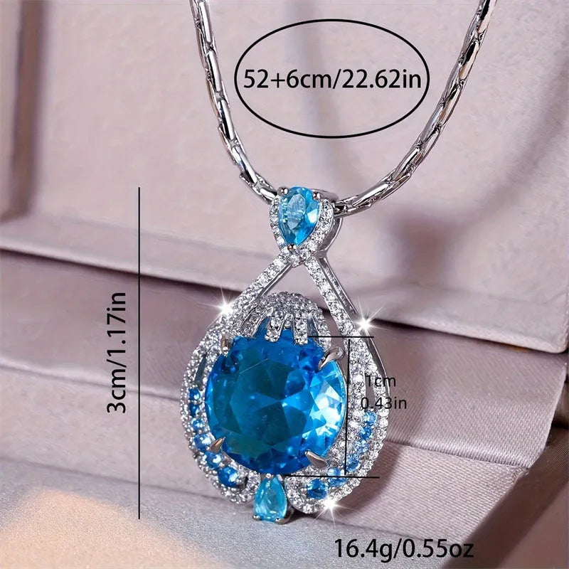 Blue geometric pendant necklace with fireworks-cut crystals on water wave chain