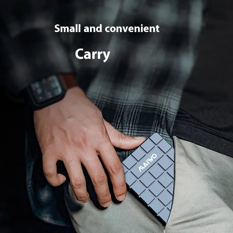 Silver aluminium USB4 hard disk box with connectors, shown next to a notebook computer
