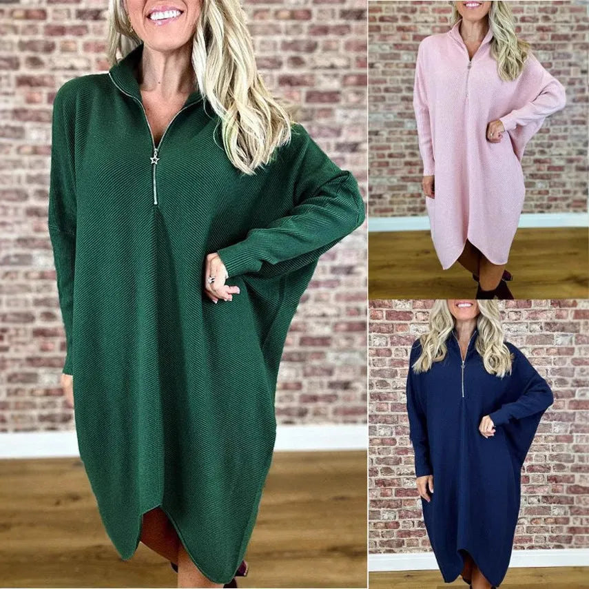 Women's solid colour loose knitted dress with raglan sleeves and a front zipper.