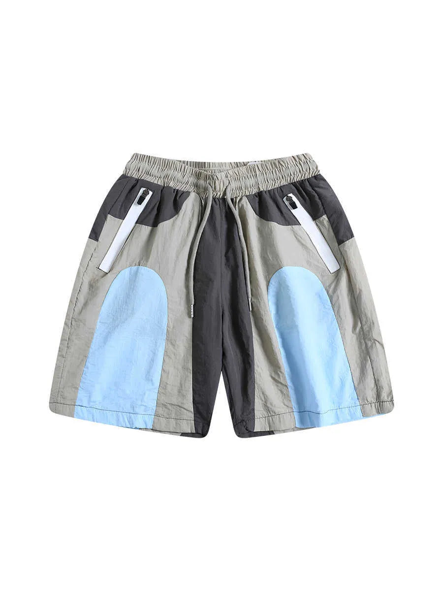 Blue patchwork quick-drying men's shorts with loose straight-leg fit and elasticated waist.
