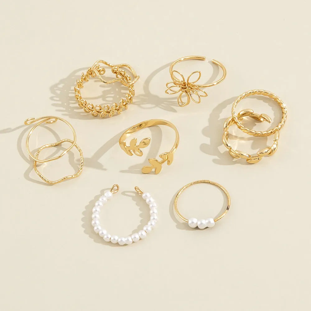 Openwork flower ring set with glossy gold finish and detailed floral pattern